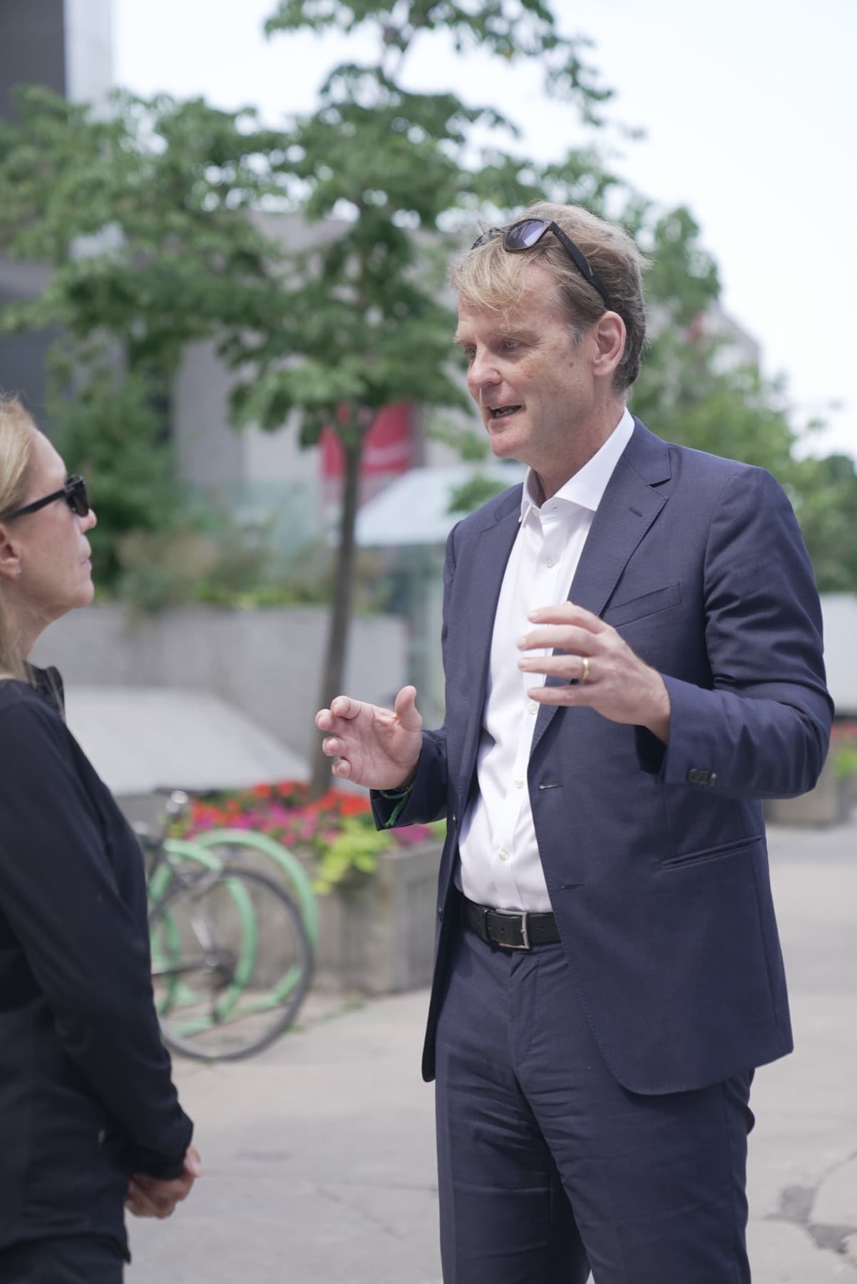 Chris Alexander speaking with a resident while canvassing
